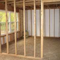 Framing is complete and windows installed.