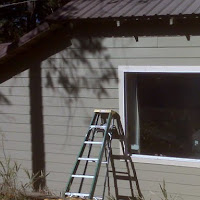 The finished product. We installed a new window, new trim, new siding, new framing and finished it off with a new coat of paint.