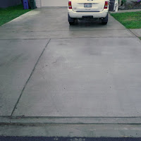 <strong>AFTER:</strong> After a few days the driveway was ready to be driven on. We gave this home a new driveway and a sidewalk and worked with the City to meet every code.