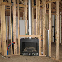 Living area after framing and fireplace was installed.