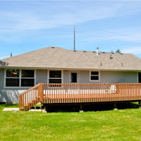 Back of house with decent sized deck.